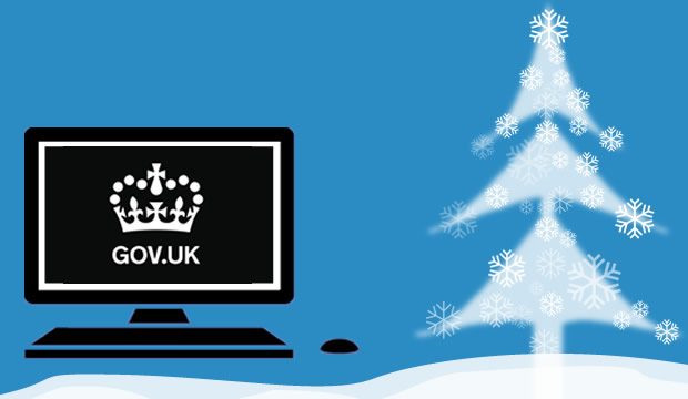 GOV.UK crown logo on a laptop with a christmas tree