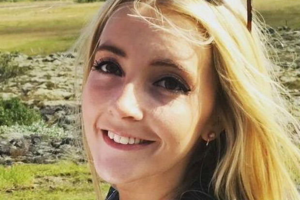 Head and shoulders image of Megan Phelps with open countryside in the background