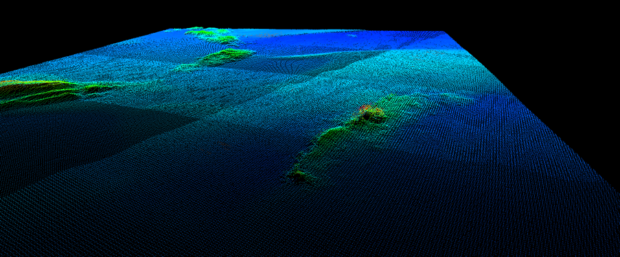 3D visual presentation of the bathymetry data gathered during the survey of a potential steamship wreck in the foreground, and rocks behind