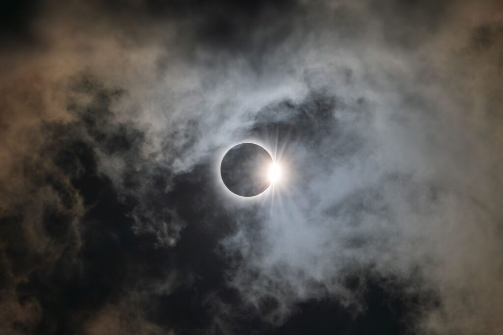 Total solar eclipse in a cloudy sky