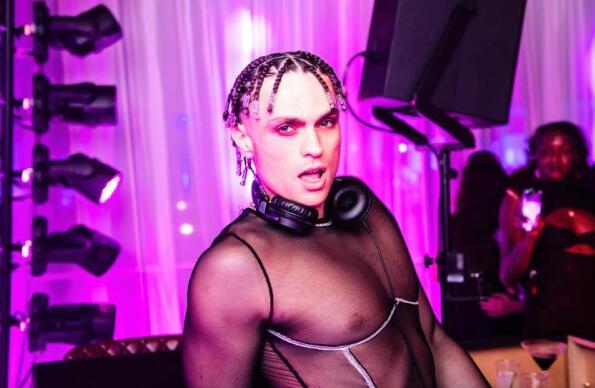 DJ Joel Mignott wearing a mesh top