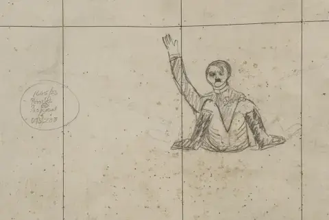 A roughly drawn pencil caricature of Adolf Hitler sat on the floor holding up his right arm, drawn onto a map in the Chiefs of Staff Conference Room.