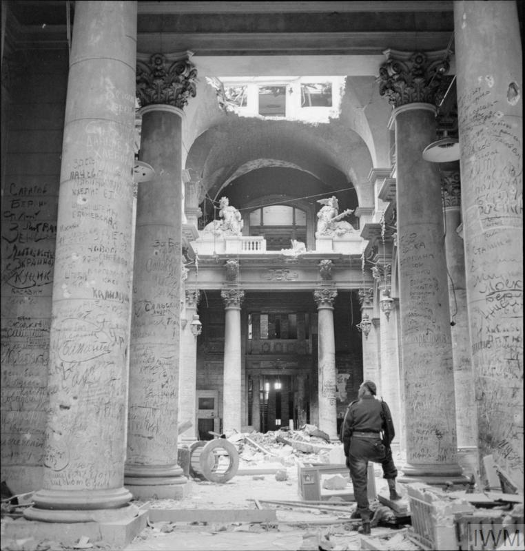 Graffiti left by Russian soldiers covers the pillars inside the ruins of the German Reichstag building in Berlin.