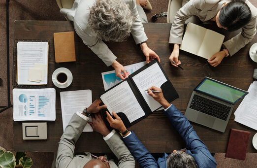 Decorative image of people working at desk