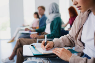 University students seated at desks