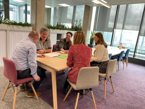 Colleagues having a discussion during the Executive Committee meet-up.