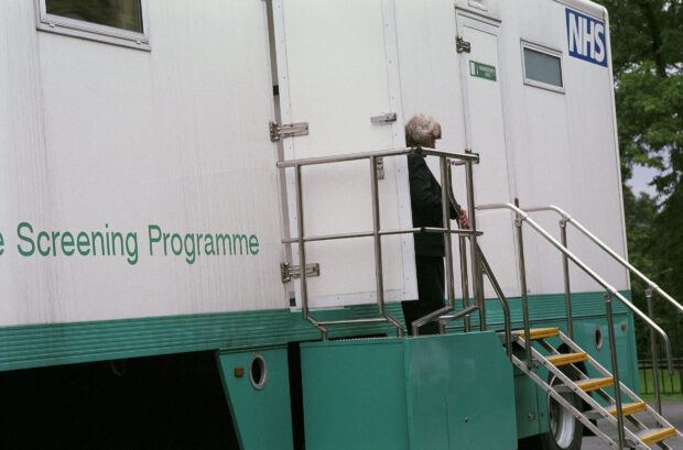 Woman leaving breast screening mobile unit.