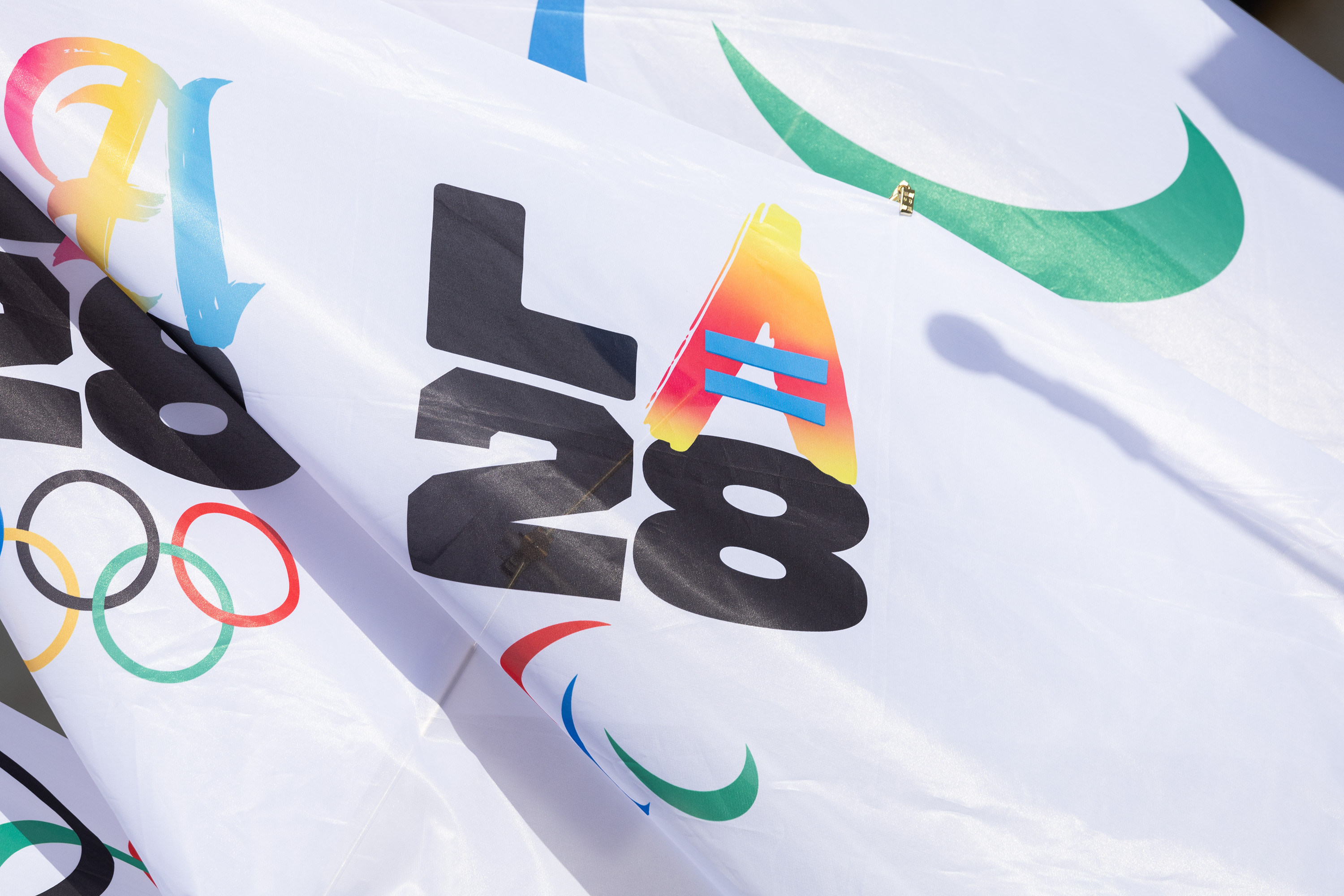 One of the variations of the 2028 Olympic logo on a flag