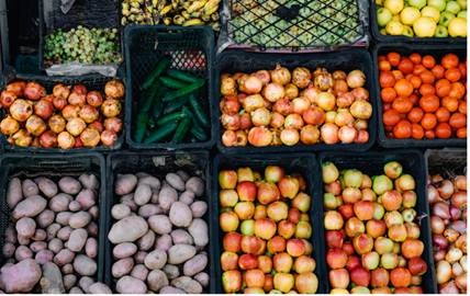 Supermarket shelves with a range of vegetables on them
