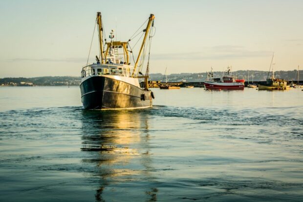 Fishing boats leaving an English harbour