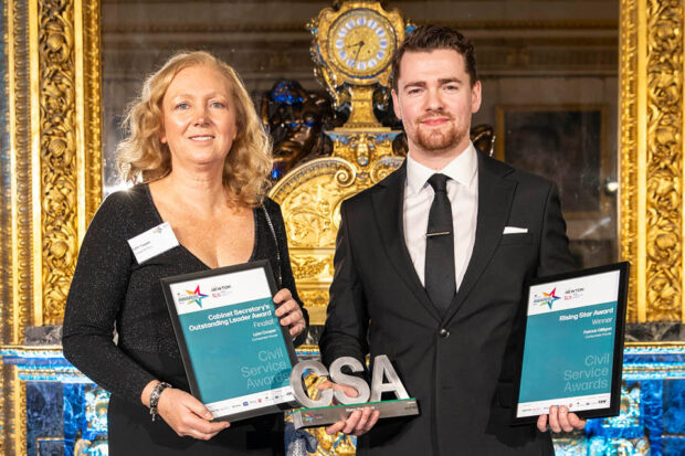 Patrick Gilligan holds his Civil Service Award trophy and certificate