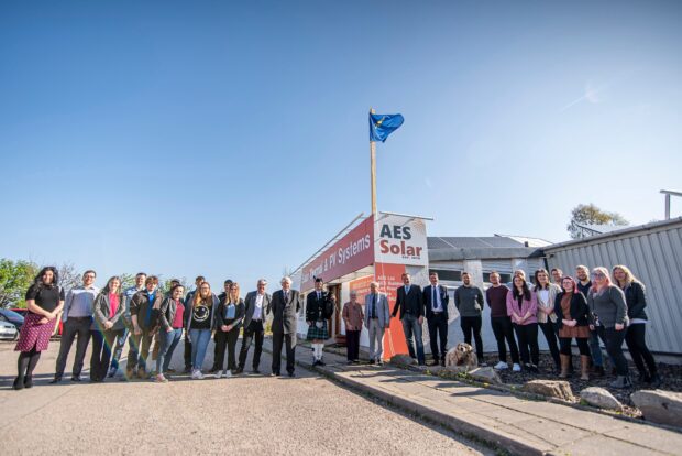 AES Solar flying Queen's Awards flag at their office