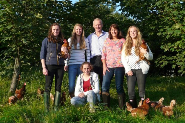 Brass family with their chickens.