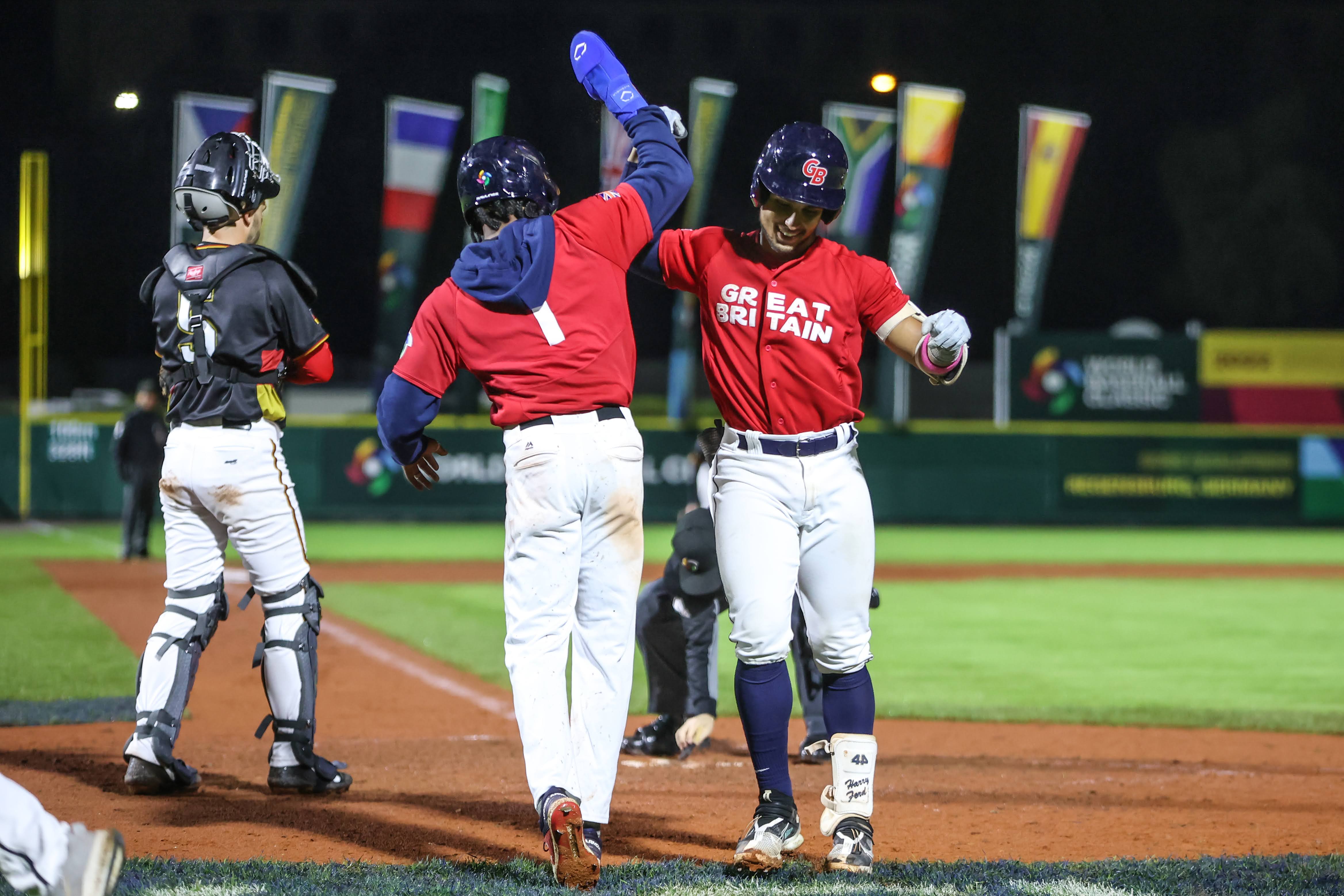 GB baseball players celebrating after a game