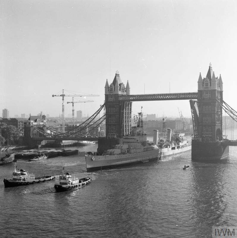 HMS BELFAST takes up her moorings in the specially dredged berth in the Pool of London, 14 October 1971.