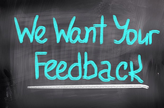 We want your feedback writing on a chalkboard.