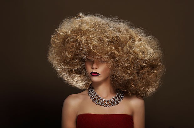 Image of a fashion model with a big curly hair style.