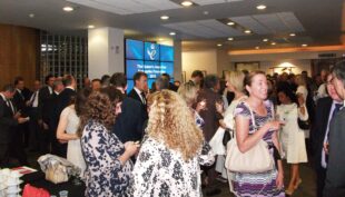 Queens Awards winners at a reception event.