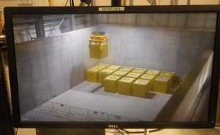 First Fuel Element Debris (FED) container being lowered into position at Interim Storage Facility (ISF) at Berkeley