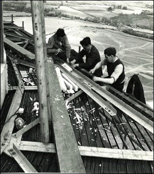 Black and white image of Sellafield workers on top of the Pile Chimney with no protective clothing on