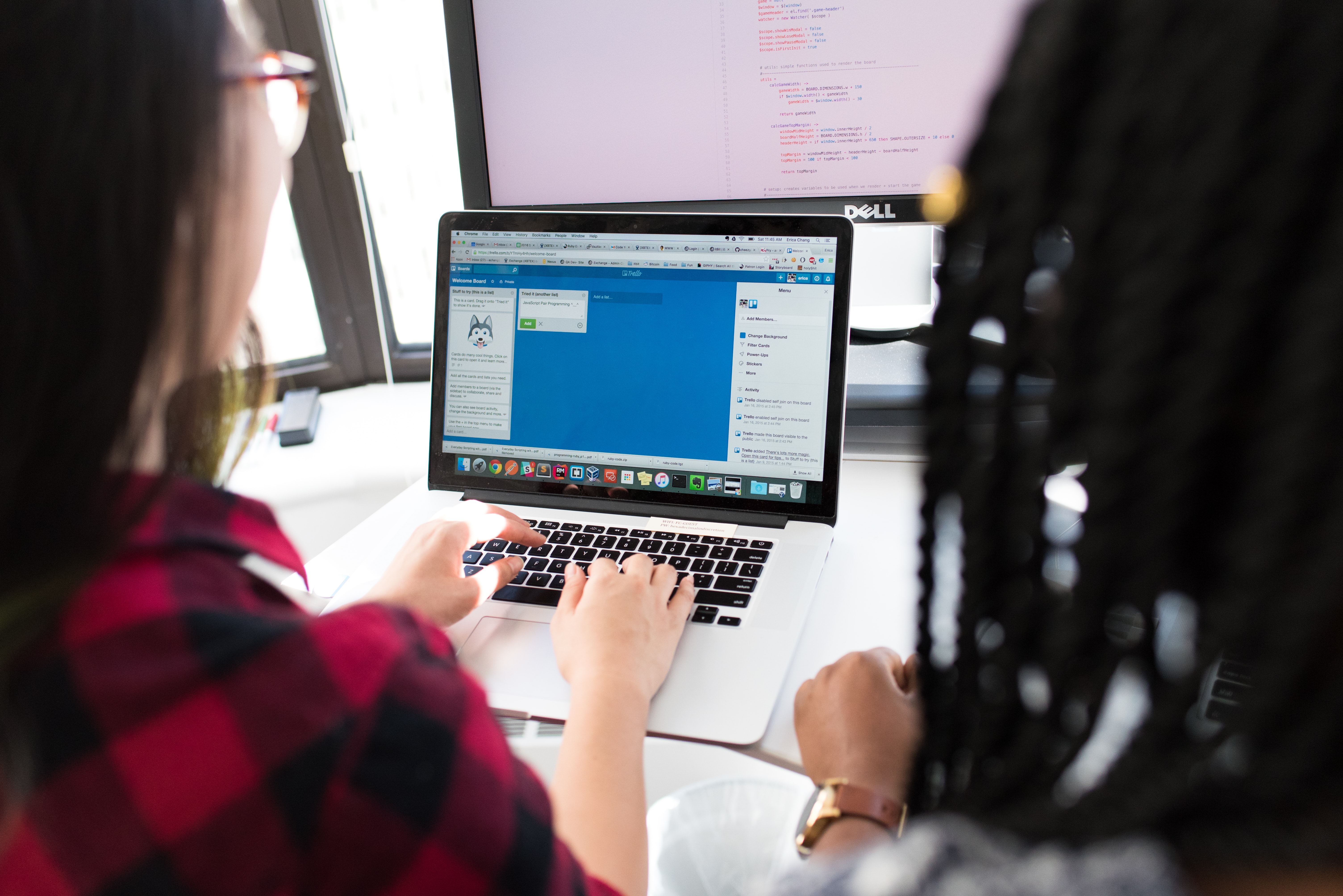 Image of two apprentices sitting at a computer at the Home Office