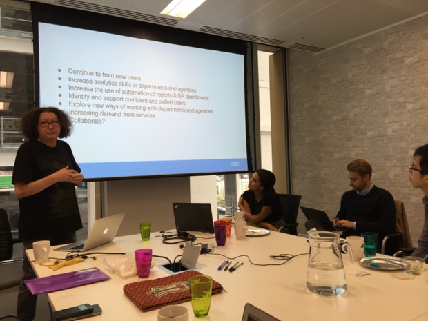 Photo of Anne Carr with slide about requirements of so many users