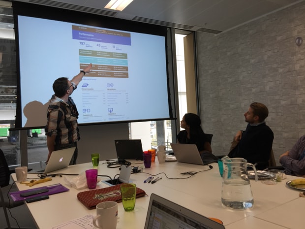 Photo of John Byrne with example of GDS Performance Dashboard