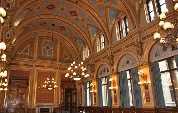 High ceiling, laced with golden paint and magnificent decorations. A very symmetrical room