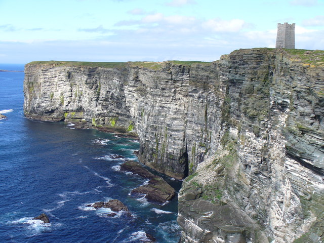 Memorial, a stone tower on top of the cliff to the ocean