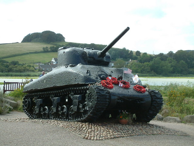 A tank abandoned as a memorial in Slapton with poppy wreaths of remembrance on it