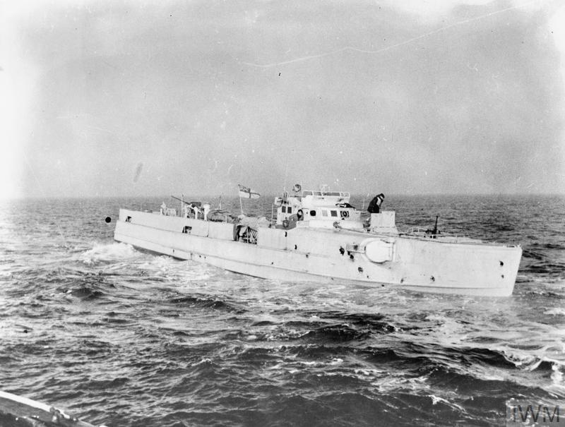 At sea, an old German E-Boat which is a mini sized warship