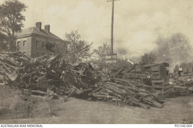 Pile of captured German MG08/15 machine guns and gun carriages discarded after capture.