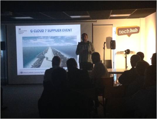 TechHub Director Paul Harwood facing an audience and presenting at the techhub