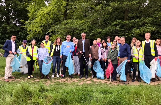 Group of people picking litter