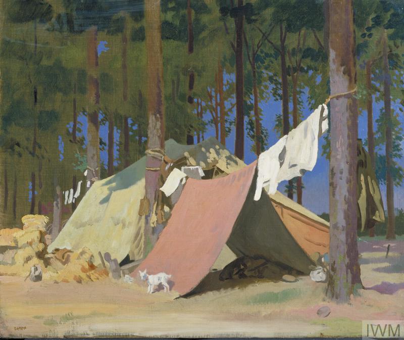 Two tents within a grove of trees, one a makeshift shelter hanging from rope suspended between two trees. A figure lies on the ground resting insdie the tent, his washing hanging to dry in the sun on the same rope as the canvas. There is a stack of supplies to the left, and a small white goat standing against the tent in the sunshine. Beyond the trees there is a deep blue sky.