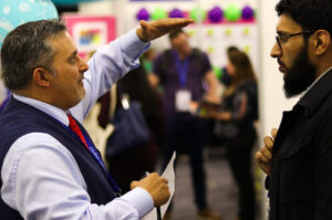 Two men in discussion at Civil Service Live