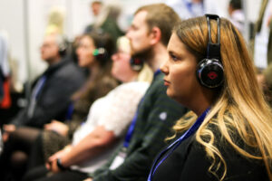 A woman listens in the audience at CSL