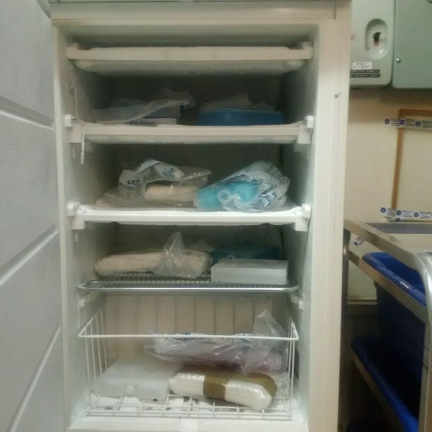 Cold packs stored in a small freezer. Cold packs are wrapped in paper which poses a hygiene hazard. There is a large variety of different types of ice packs with no control on this or how long the individual packs have been conditioned for.