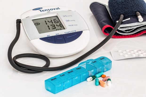 Blood pressure monitor and cuff with assortment of pharmaceutical tablets and capsules