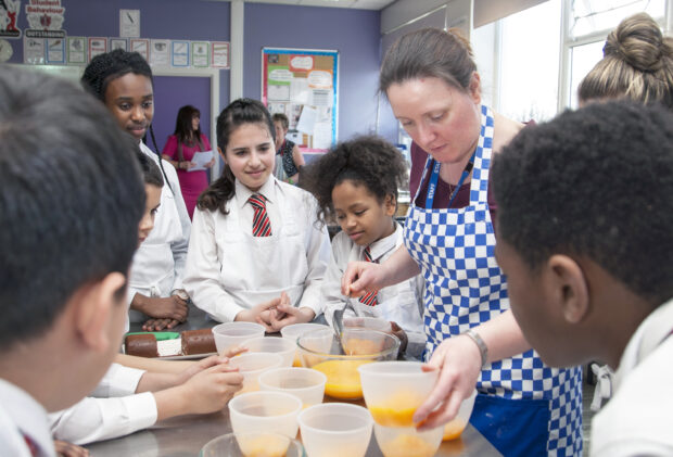 Pupils watching a cookery demonstration