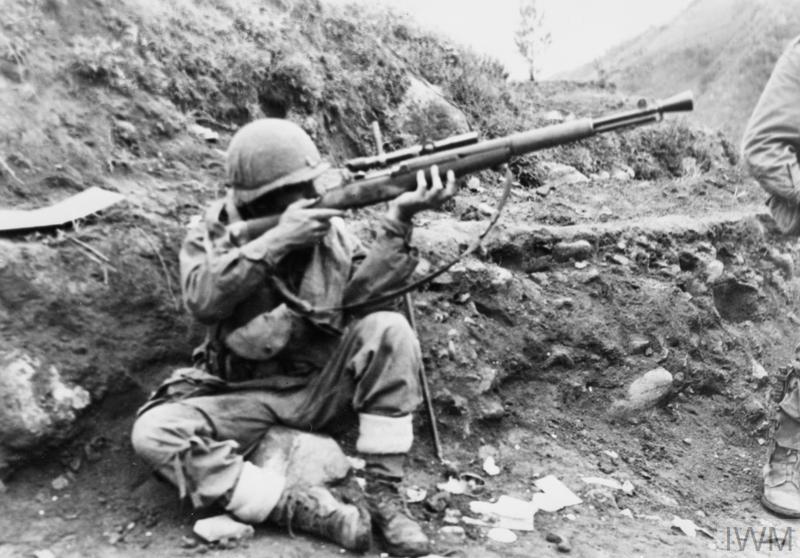 Sergeant Wedel Hulzen, of the Netherlands detachment of the UN forces in Korea, in position to return sniper fire.