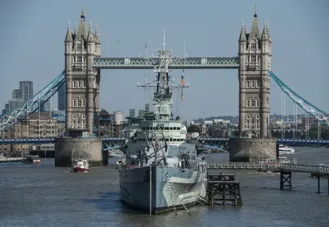 HMS Belfast on the Thames in front of Tower Bridge.