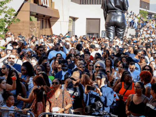 A large crowd outdoors at a festival