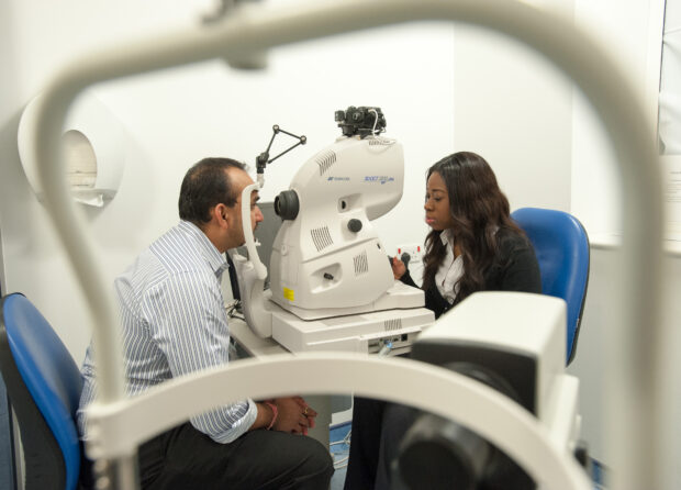 A man having an eye screening test done.