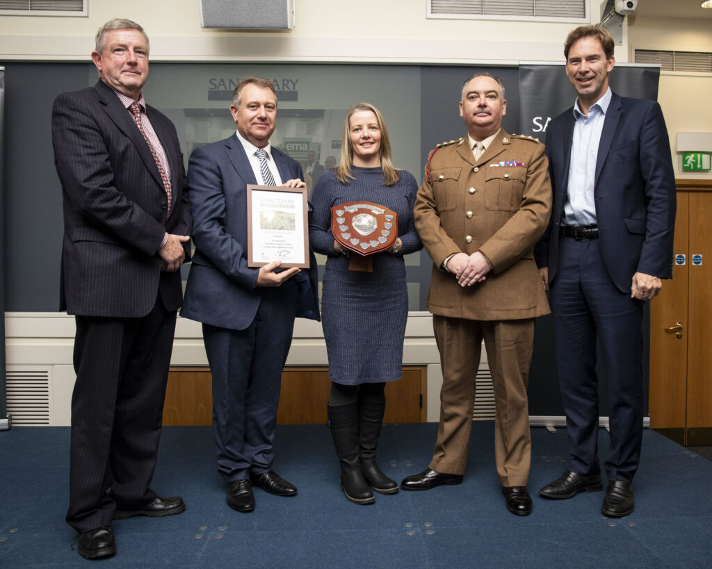Members of the Energy Management Team of 29 Regiment, The Royal Logistic Corps, pose with their awards and Minster of Defence Personnel and Veterans, Tobias Ellwood MP.