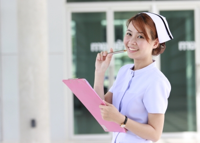 A nurse holding a clipboard and pen.