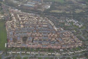 Aerial view of the site for the new homes in February 2015, showing the rapid progression of the project. [Copyright Lovell]