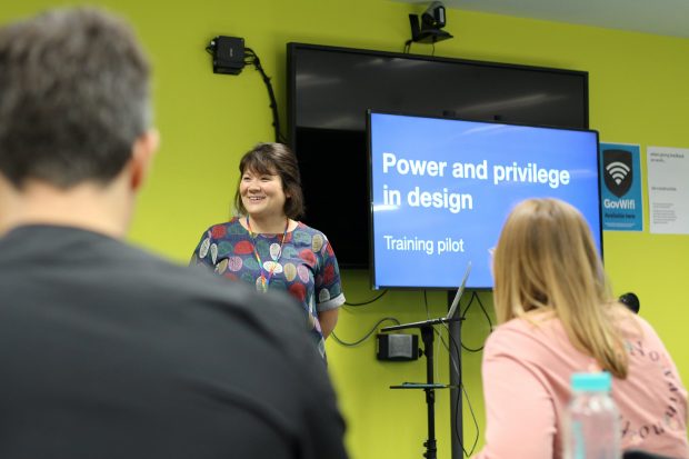 Design trainer Clara Greo standing in front of participants of the new Power and Privilege training at the Government Digital Service