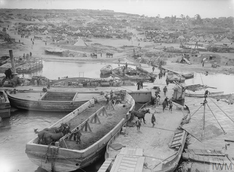A view of 'V' Beach, Cape Helles, Gallipoli, taken from SS RIVER CLYDE. Horses are disembarked from the nearest lighter.