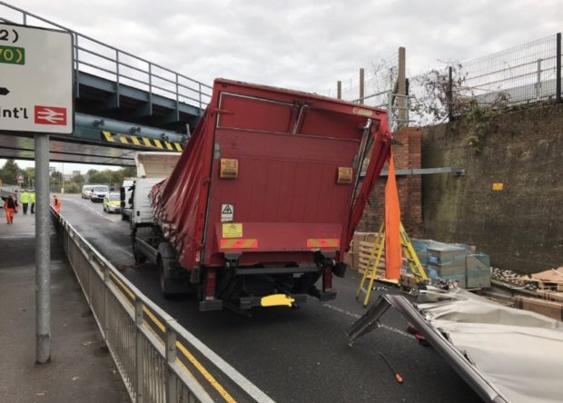Bridge strike showing a damaged lorry that has hit a bridge